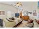 Bright main bedroom featuring carpet, a ceiling fan, and lots of natural light at 42370 W Hillman Dr, Maricopa, AZ 85138