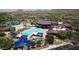 An aerial view of the waterpark, community center, and pool, offering resort style living at 42424 N Gavilan Peak Pkwy # 63212, Anthem, AZ 85086