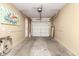 Spacious garage with white door and concrete floor, featuring vibrant pop art accents at 42424 N Gavilan Peak Pkwy # 63212, Anthem, AZ 85086