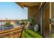 Relaxing balcony with a table, chairs, plants and view of trees at 425 S Parkcrest Dr # 334, Mesa, AZ 85206