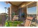Inviting balcony with cozy seating, stylish decor, and scenic community view at 425 S Parkcrest Dr # 334, Mesa, AZ 85206