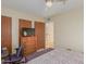 Cozy bedroom featuring a ceiling fan, dresser with TV, and a comfortable, patterned bed at 425 S Parkcrest Dr # 334, Mesa, AZ 85206