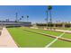 Well-maintained bocce ball court with benches and lush landscaping creating a relaxing recreational space at 425 S Parkcrest Dr # 334, Mesa, AZ 85206