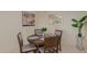 Dining room with round table and four chairs with views of nearby kitchen and mirror at 425 S Parkcrest Dr # 334, Mesa, AZ 85206