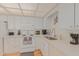Well-lit kitchen with white cabinetry and countertop appliances at 425 S Parkcrest Dr # 334, Mesa, AZ 85206