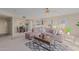 Comfortable living room features a sectional sofa and open access to the dining room and kitchen at 425 S Parkcrest Dr # 334, Mesa, AZ 85206