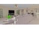 Spacious living room with an entertainment center and open access to the dining area and kitchen at 425 S Parkcrest Dr # 334, Mesa, AZ 85206