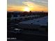 Picturesque sunset view overlooking rooftops with mountains in the distance, capturing the beauty of the community at 425 S Parkcrest Dr # 334, Mesa, AZ 85206