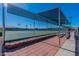 Fenced tennis court with shading, providing a great space for recreational play and community activities at 425 S Parkcrest Dr # 334, Mesa, AZ 85206