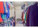 Spacious walk-in closet with organized shelving and hanging space to maximize storage at 425 S Parkcrest Dr # 334, Mesa, AZ 85206