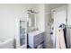 Updated bathroom with vanity, mirror, and tiled shower with white shower curtain at 4332 E Calle Redonda St, Phoenix, AZ 85018