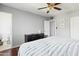 Bedroom with hardwood floors, ceiling fan, and updated bathroom access at 4332 E Calle Redonda St, Phoenix, AZ 85018