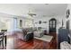 Spacious living room with hardwood floors, a ceiling fan, and neutral decor at 4332 E Calle Redonda St, Phoenix, AZ 85018