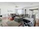 Bright living room featuring a large gray sectional, hardwood floors, and neutral tones at 4332 E Calle Redonda St, Phoenix, AZ 85018