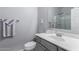 Clean bathroom featuring modern fixtures, gray cabinets, and tiled floor at 45975 W Mountain View Rd, Maricopa, AZ 85139