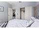 Bedroom featuring neutral tones, a comfortable bed, and an open doorway at 45975 W Mountain View Rd, Maricopa, AZ 85139