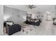 Open-concept living area with a comfortable seating arrangement and lots of natural light at 45975 W Mountain View Rd, Maricopa, AZ 85139