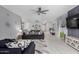 Bright, airy living space with an open floor plan and stylish tile flooring throughout at 45975 W Mountain View Rd, Maricopa, AZ 85139