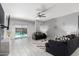 Modern living room with sleek tile floors, contemporary decor, and a sliding glass door at 45975 W Mountain View Rd, Maricopa, AZ 85139