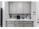 Coffee bar/butler's pantry with plenty of storage and counter space at 45975 W Mountain View Rd, Maricopa, AZ 85139