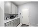 Pantry area features ample cabinet space and a countertop for coffee and appliances at 45975 W Mountain View Rd, Maricopa, AZ 85139