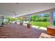 Large patio with outdoor kitchen, dining, seating, well maintained yard, and a pool at 4739 N 34Th Pl, Phoenix, AZ 85018
