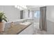 Bathroom featuring a granite countertop, white cabinets, and shower-tub combo with curtain at 4739 N 34Th Pl, Phoenix, AZ 85018