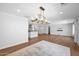 Spacious dining area with hardwood floors and modern lighting fixtures, perfect for entertaining and Gathering gatherings at 4739 N 34Th Pl, Phoenix, AZ 85018