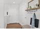 Bright entryway featuring wood floors, white walls, and a coat rack with mirror for added convenience at 4739 N 34Th Pl, Phoenix, AZ 85018