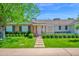 Charming single-story home featuring brick accents, a well-manicured lawn, and beautiful curb appeal at 4739 N 34Th Pl, Phoenix, AZ 85018