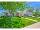 Single-story home features brick accents, attached garage, and a lush green lawn under a clear sky at 4739 N 34Th Pl, Phoenix, AZ 85018