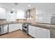 Stylish kitchen features stainless steel appliances, tile backsplash, and granite countertops at 4739 N 34Th Pl, Phoenix, AZ 85018