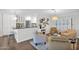Open-concept living space with hardwood floors, modern lighting, and comfortable seating arrangements at 4739 N 34Th Pl, Phoenix, AZ 85018