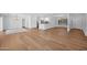 Open-concept living space with hardwood floors, white cabinetry, and an abundance of natural light at 4739 N 34Th Pl, Phoenix, AZ 85018