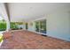 Spacious covered patio features brick flooring and sliding glass doors to the home at 4739 N 34Th Pl, Phoenix, AZ 85018