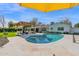 Stunning backyard featuring a sparkling pool, covered pergola, and ample patio space at 4739 N 34Th Pl, Phoenix, AZ 85018