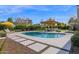 Inviting backyard with a beautiful pool, pergola, and lush landscaping for outdoor enjoyment at 4739 N 34Th Pl, Phoenix, AZ 85018