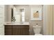 Well-lit bathroom with a modern vanity, framed mirror, and shower with neutral tile at 4781 E Danta St, San Tan Valley, AZ 85143