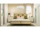 Inviting bedroom with a textured headboard, decorative pillows, and soft, natural lighting at 4781 E Danta St, San Tan Valley, AZ 85143