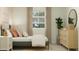 Bright bedroom with stylish furnishings, a window, and trendy decor at 4781 E Danta St, San Tan Valley, AZ 85143