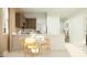 Bright kitchen with stainless steel appliances, a breakfast bar, and a dining area with modern chairs at 4781 E Danta St, San Tan Valley, AZ 85143