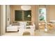 Cozy living room with a comfortable white sectional sofa, modern lighting, and stylish decor at 4781 E Danta St, San Tan Valley, AZ 85143