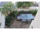 Outdoor dining area featuring a glass-topped table and seating, set in a stone-paved courtyard at 4927 E Hazel Dr # 2, Phoenix, AZ 85044