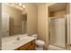 Bathroom with vanity, toilet, and shower with a glass door at 4927 E Hazel Dr # 2, Phoenix, AZ 85044