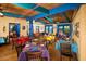 Vibrant dining area with colorful tablecloths, rustic wooden chairs, and ample natural light at 4927 E Hazel Dr # 2, Phoenix, AZ 85044