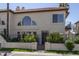 Charming two-story house featuring a unique arched window and well-maintained landscaping at 4927 E Hazel Dr # 2, Phoenix, AZ 85044
