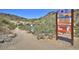 Desert trail with signage offering information about heat safety and warnings in a desert landscape at 4927 E Hazel Dr # 2, Phoenix, AZ 85044