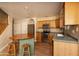 Kitchen featuring wood cabinets, stainless steel appliances, a charming island with seating, and lots of counter space at 4927 E Hazel Dr # 2, Phoenix, AZ 85044