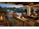 Inviting outdoor patio with comfortable seating, fire feature, and views of the well-manicured landscape at 4927 E Hazel Dr # 2, Phoenix, AZ 85044