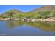Scenic pond reflecting nearby hills and trees, enhancing the natural beauty of the community at 4927 E Hazel Dr # 2, Phoenix, AZ 85044